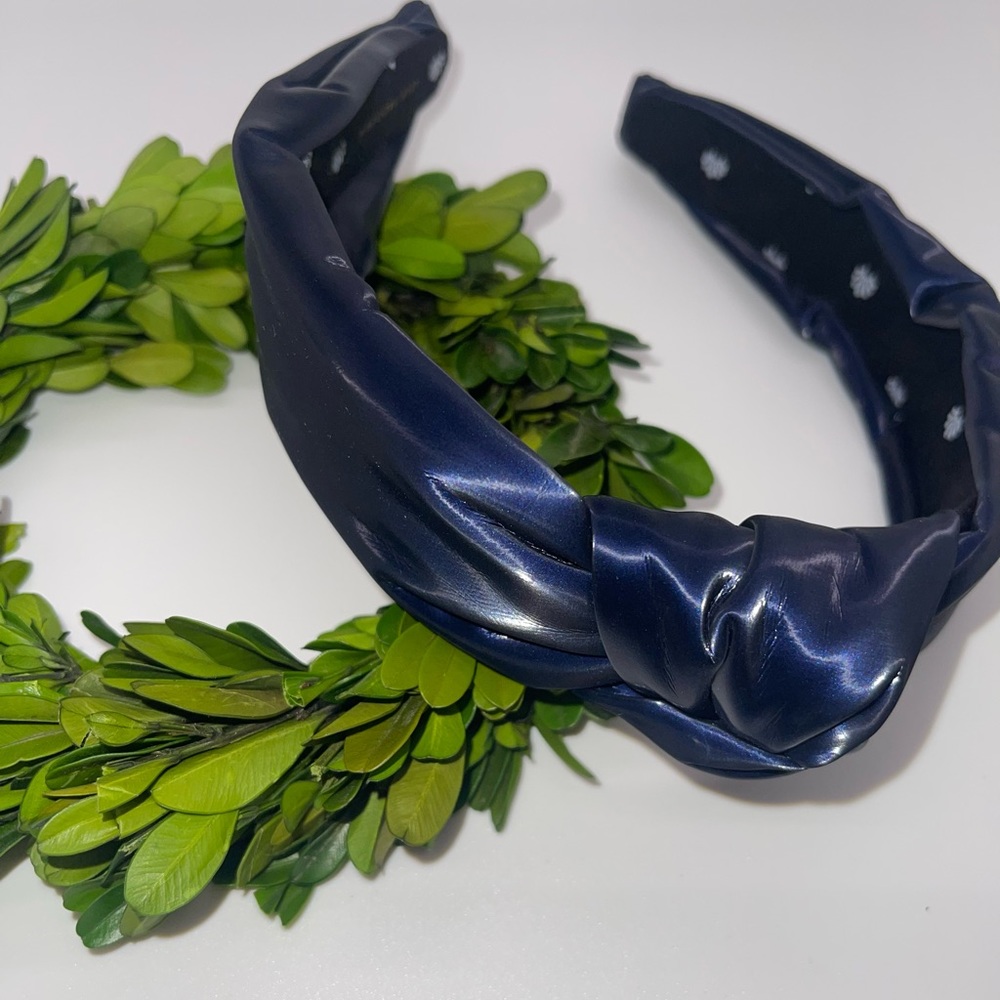 Lele Sadoughi vegan leather headband in a deep/dark slightly-metallic blue.